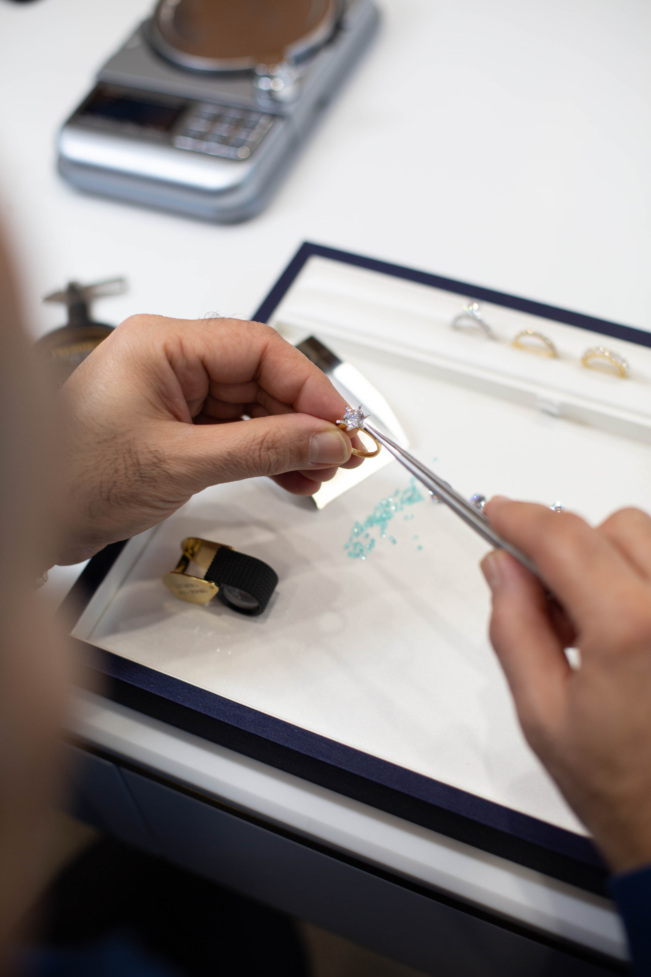 Nathan selecting diamonds and gemstones for a bespoke commission